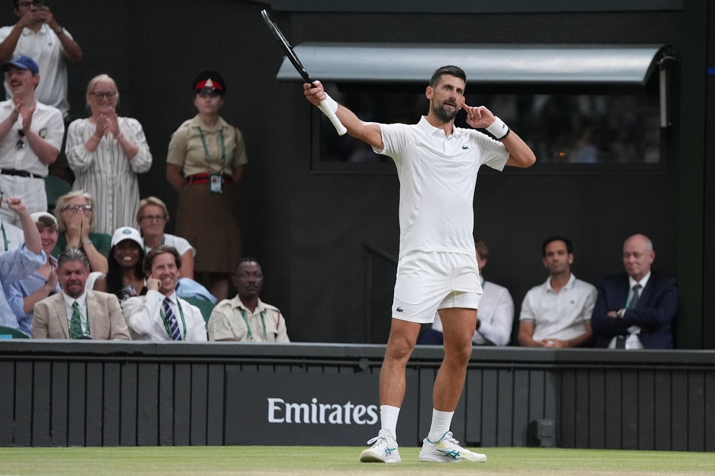 Novak Djokovic of Serbia reacts during the super tie-break against Felix Auger-Aliassime of Canada in their quarter-final men's singles match at the Wimbledon Tennis Championships in London, Tuesday, July 7, 2026. (AP Photo/Maja Smiejkowska)