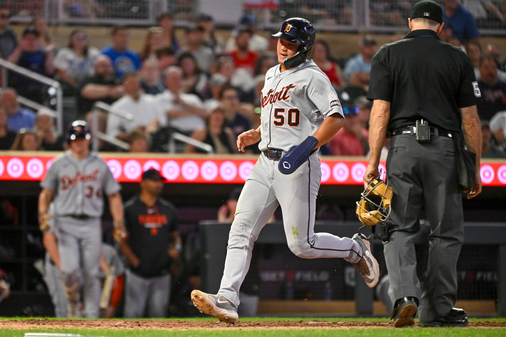 Detroit Tigers' Hao-Yu Lee scores on a RBI double by Riley Greene against the Minnesota Twins during the fifth inning of a baseball game Wednesday, Sept. 2, 2026, in Minneapolis. (AP Photo/Craig Lassig)