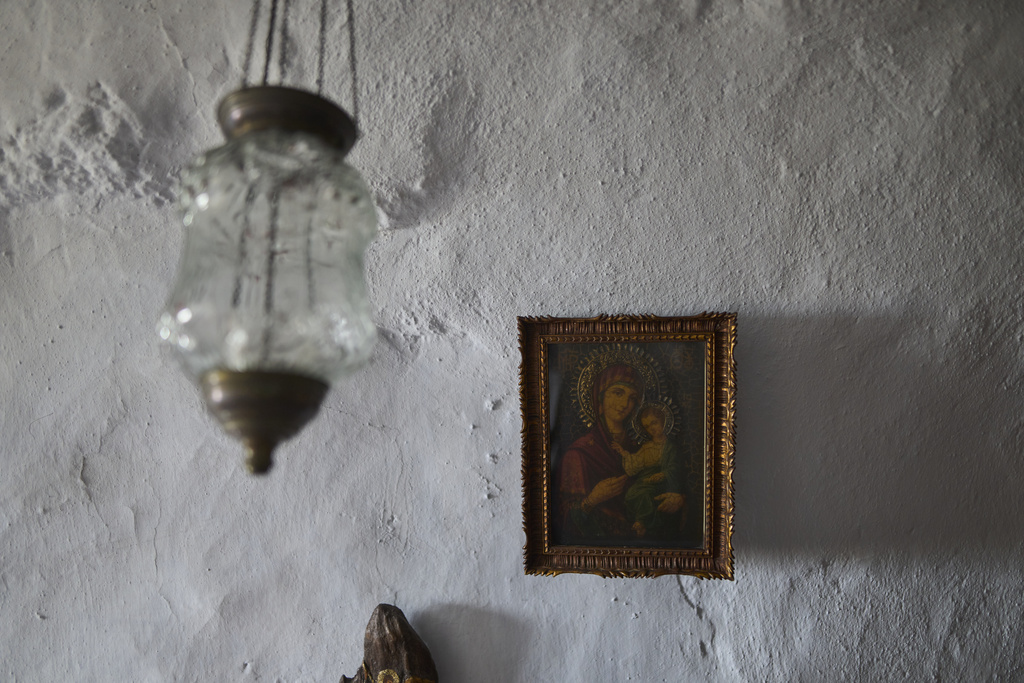 An icon of the Virgin Mary holding the Christ child is displayed inside Agios Giorgos (St. George), a 200-year-old chapel near the village of Volax on Tinos island, Greece, Thursday, Sept. 4, 2025. (AP Photo/Petros Giannakouris)