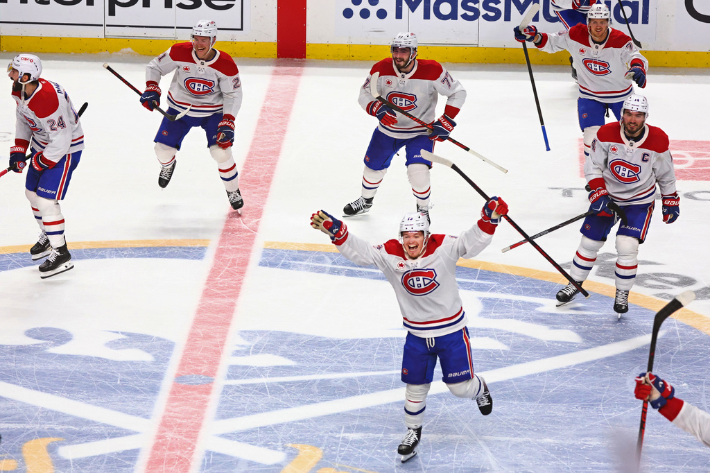 Montreal Canadiens players celebrate following the overtime period in Game 7 of a second-round NHL hockey Stanley Cup playoff series against the Buffalo Sabres, Monday, May 18, 2026, in Buffalo, N.Y. (AP Photo/Jeffrey T. Barnes)