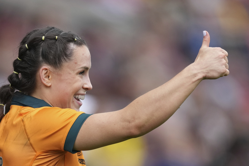 Desiree Miller of Australia celebrates during the group A match at the 2025 Women's Rugby World Cup between Australia and Samoa in Manchester, England, Saturday, Aug. 23, 2025. (AP Photo/Dave Shopland)