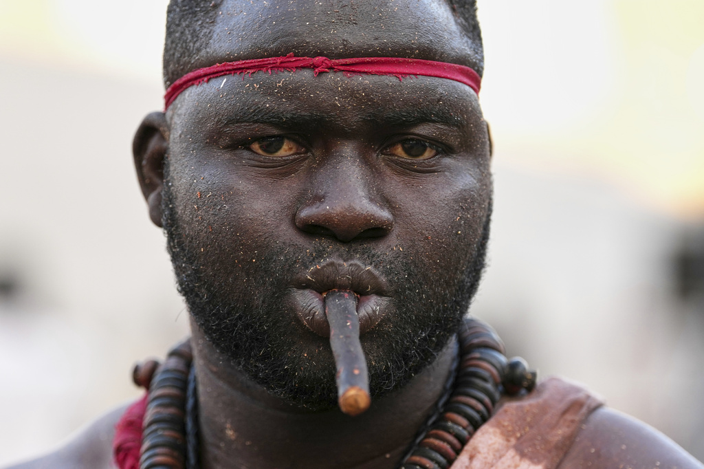 A wrestler waits to compete at the national wrestling arena in Dakar, Senegal, Sunday, March 29, 2026. (AP Photo/Misper Apawu)
