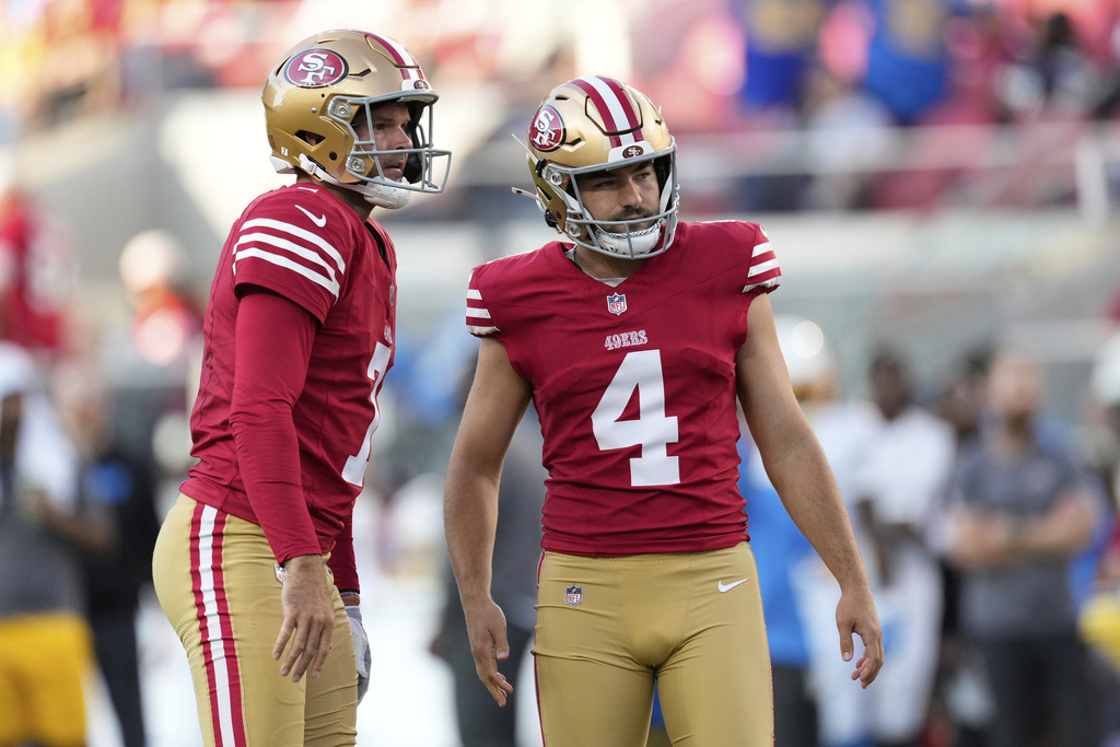 San Francisco 49ers place kicker Jake Moody (4) reacts after missing a point after try with Thomas Morstead during the first half of an NFL preseason football game against the Los Angeles Chargers in Santa Clara, Calif., Saturday, Aug. 23, 2025. (AP Photo/Godofredo A. Vásquez)