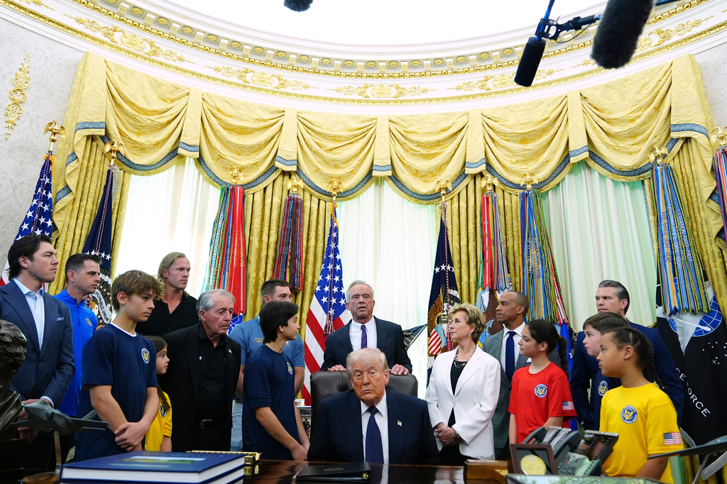 Health and Human Services Secretary Robert F. Kennedy Jr. speaks as President Donald Trump listens before the signing of a proclamation in the Oval Office at the White House, Tuesday, May 5, 2026, in Washington. (AP Photo/Jacquelyn Martin)