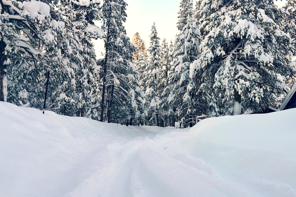 A street is covered in snow on Wednesday, Feb. 18, 2026 in Truckee Calif. (AP Photo/Brooke Hess-Homeier)
