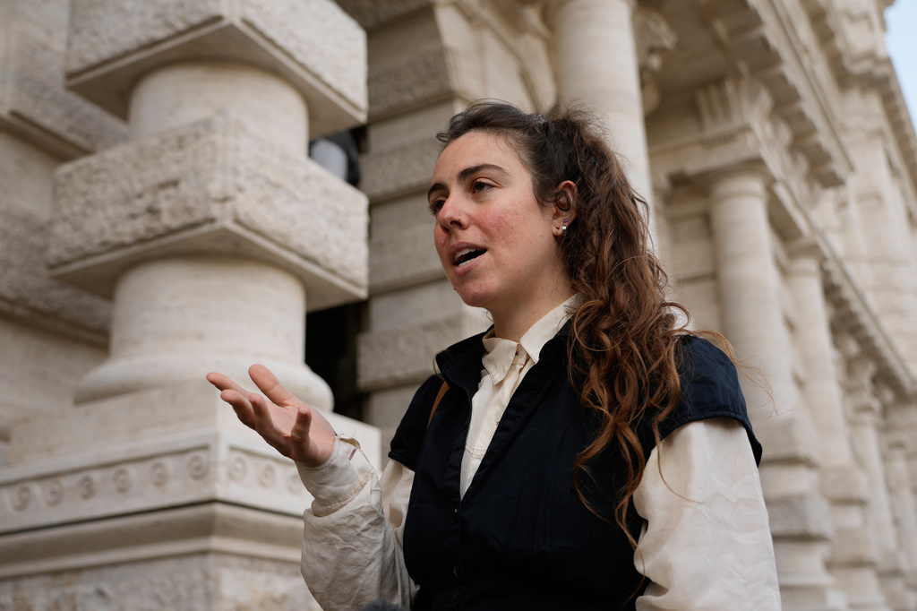 Alexis Traino, from the United States, is interviewed by the Associated Press outside Italy's highest Court of Cassation, in Rome, Tuesday, April 14, 2026, prior to the start of a hearing to argue against the new citizenship law that restricts citizenship by descent. (AP Photo/Gregorio Borgia)