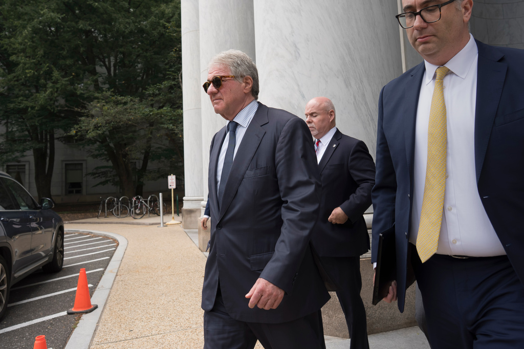 Leon Black, left, walks out of the Rayburn House Office Building at the Capitol after he cut short his interview about Epstein with the House Oversight Committee, in Washington, Friday, June 26, 2026. (AP Photo/J. Scott Applewhite)