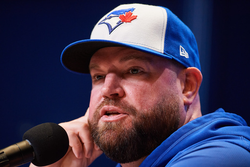 Toronto Blue Jays manager John Schneider speaks with the media ahead of Game 1 of baseball's American League Championship Series against the Seattle Mariners in Toronto, Saturday, Oct. 11, 2025. (Sammy Kogan/The Canadian Press via AP) Toronto Blue Jays manager John Schneider speaks with the media ahead of Game 1 of baseball's American League Championship Series against the Seattle Mariners in Toronto, Saturday, Oct. 11, 2025. (Sammy Kogan/The Canadian Press via AP)