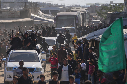 Hamas gunmen escort buses carrying freed Palestinian prisoners arriving in the Gaza Strip after their release from Israeli jails under a ceasefire agreement between Hamas and Israel, in Khan Younis, southern Gaza Strip, Monday, Oct. 13, 2025. (AP Photo/Jehad Alshrafi) Hamas gunmen escort buses carrying freed Palestinian prisoners arriving in the Gaza Strip after their release from Israeli jails under a ceasefire agreement between Hamas and Israel, in Khan Younis, southern Gaza Strip, Monday, Oct. 13, 2025. (AP Photo/Jehad Alshrafi)