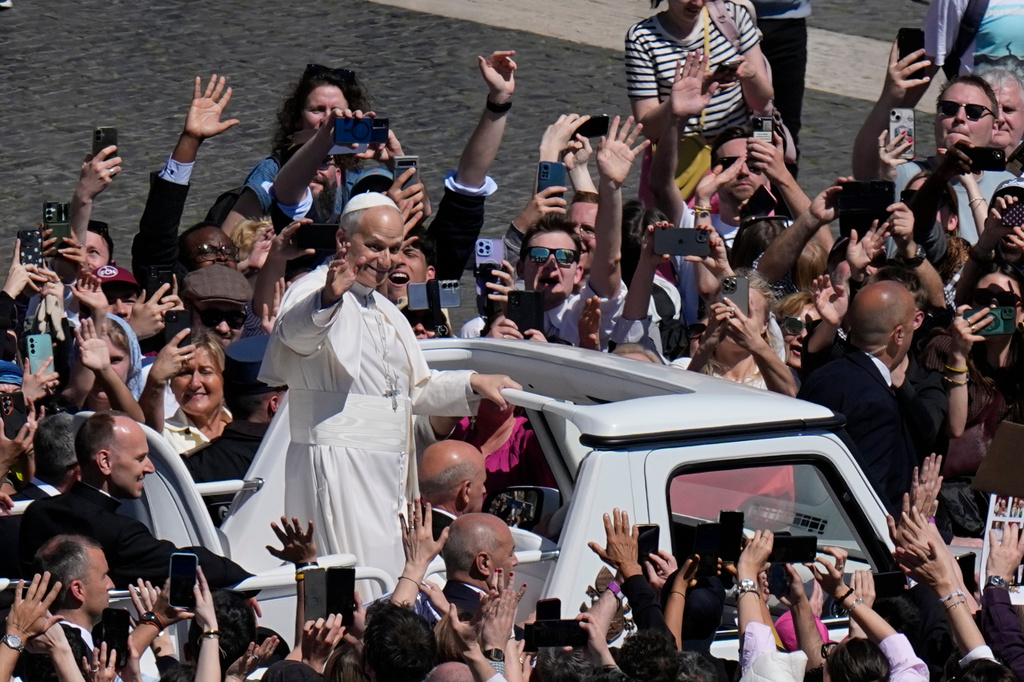 Pope Leo XIV greets the faithful at the end of Easter Mass he presided over in St. Peter's Square at the Vatican, Sunday, April 5, 2026. (AP Photo/Alessandra Tarantino)