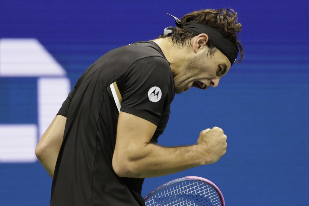 Taylor Fritz, of the United States, reacts to winning a point against Novak Djokovic, of Serbia, during the quarterfinal round of the U.S. Open tennis championships, Tuesday, Sept. 2, 2025, in New York. (AP Photo/Adam Hunger)