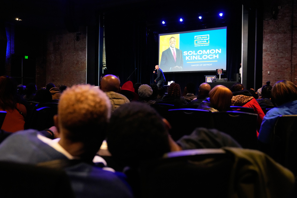 Wanda Jones, left, and grandson Camari Edwards, 11, attend an election night watch party for Detroit mayoral candidate Solomon Kinloch on Tuesday, Nov. 4, 2025, in Detroit. (AP Photo/Ryan Sun)
