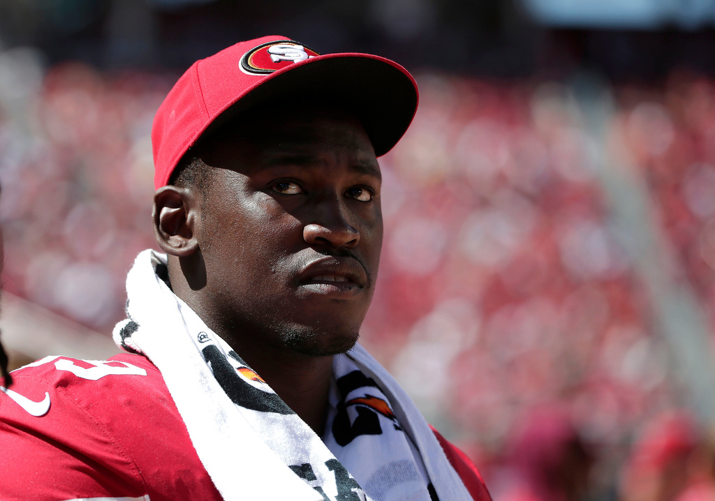 FILE - San Francisco 49ers linebacker Aldon Smith (99) watches from the sideline during the second half of an NFL preseason football game against the Denver Broncos Aug. 17, 2014, in Santa Clara, Calif. (AP Photo/Marcio Jose Sanchez, File)