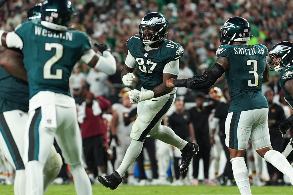 Philadelphia Eagles defensive tackle Moro Ojomo (97) celebrates with teammates after stopping the Washington Commanders on a two-pint conversion attempt during the second half of an NFL football game, Sunday, Sept. 13, 2026, in Philadelphia. (AP Photo/Matt Rourke)