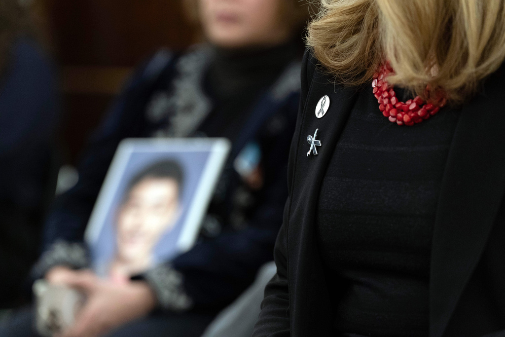 Family members of the people who were killed in the midair collision near Washington Reagan National Airport listen the National Transportation Safety Board (NTSB) Chairwoman Jennifer Homendy as she testifies before the Senate Committee on Commerce, Science, and Transportation hearing at Capitol Hill, Thursday, Feb. 12, 2026, in Washington. (AP Photo/Jose Luis Magana)