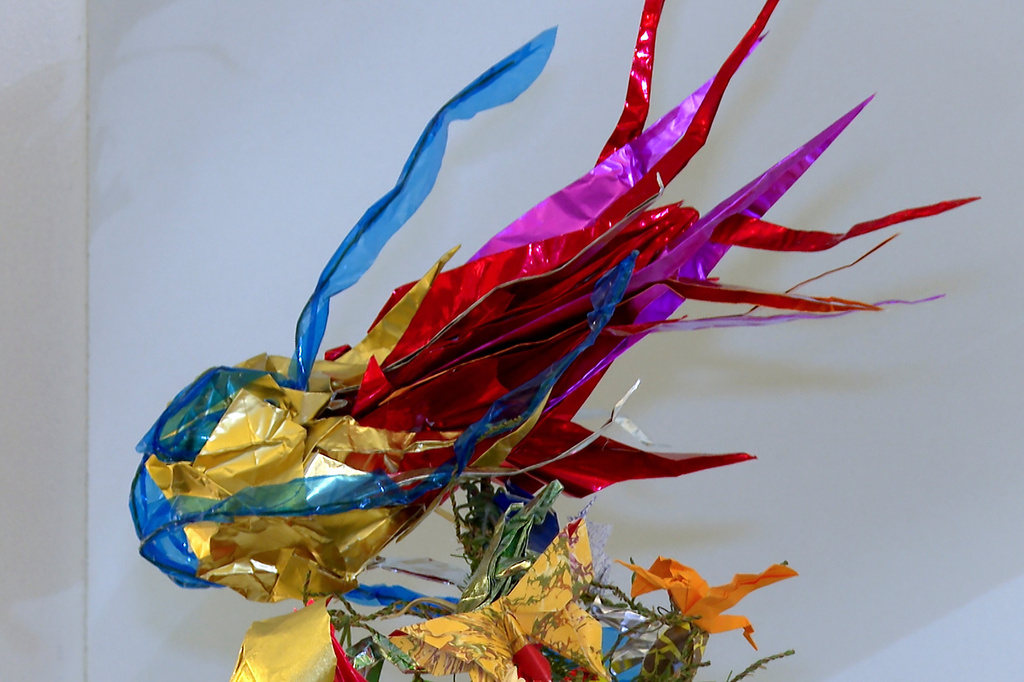 A colorful origami asteroid tops the Origami Holiday Tree at the American Museum of Natural History, Thursday, Nov. 13, 2025, in New York. (AP Photo/Joe Frederick)