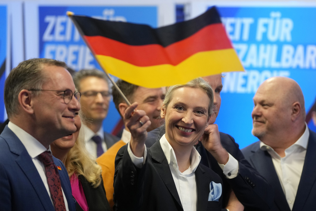 FILE - Leader of far right AfD Alice Weidel waves a German flag at the AfD party headquarters in Berlin, Germany, Sunday, Feb. 23, 2025, after the German national election. (AP Photo/Michael Probst, File)