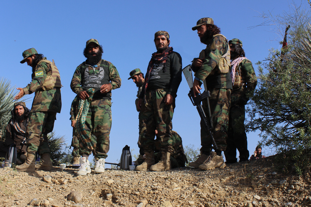 Afghan servicemen guard along the border in the Zazai Maidan district of Khost province, Afghanistan, Sunday, Oct. 12, 2025, after overnight clashes with Pakistan's forces. (AP Photo/Saifullah Zahir)