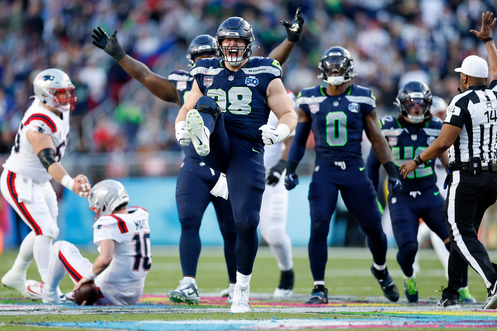 Seattle Seahawks Rylie Mills (98) celebrates after sacking New England Patriots Drake Maye (10) during the second quarter of Super Bowl 60 in Santa Clara, Calif., Sunday, Feb. 8, 2026. (Scott Strazzante/San Francisco Chronicle via AP)