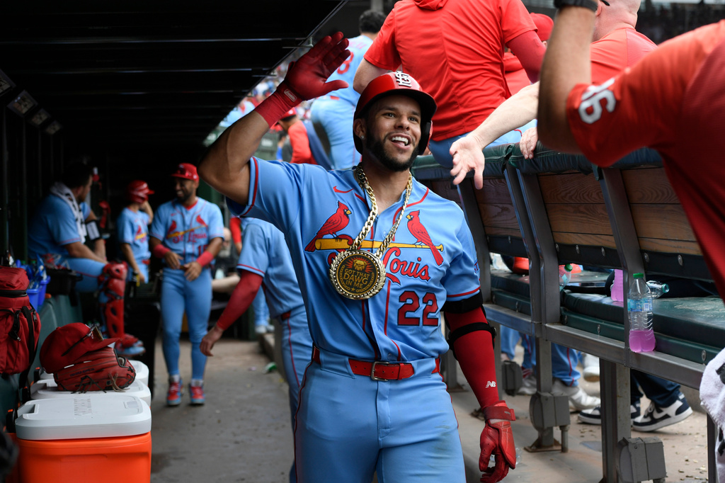 St. Louis Cardinals' Joshua Baez (22) celebrates with teammates in the dugout after hitting a solo home run during the fourth inning of a baseball game against the Chicago Cubs in Chicago, Saturday, Aug. 15, 2026. (AP Photo/Paul Beaty)