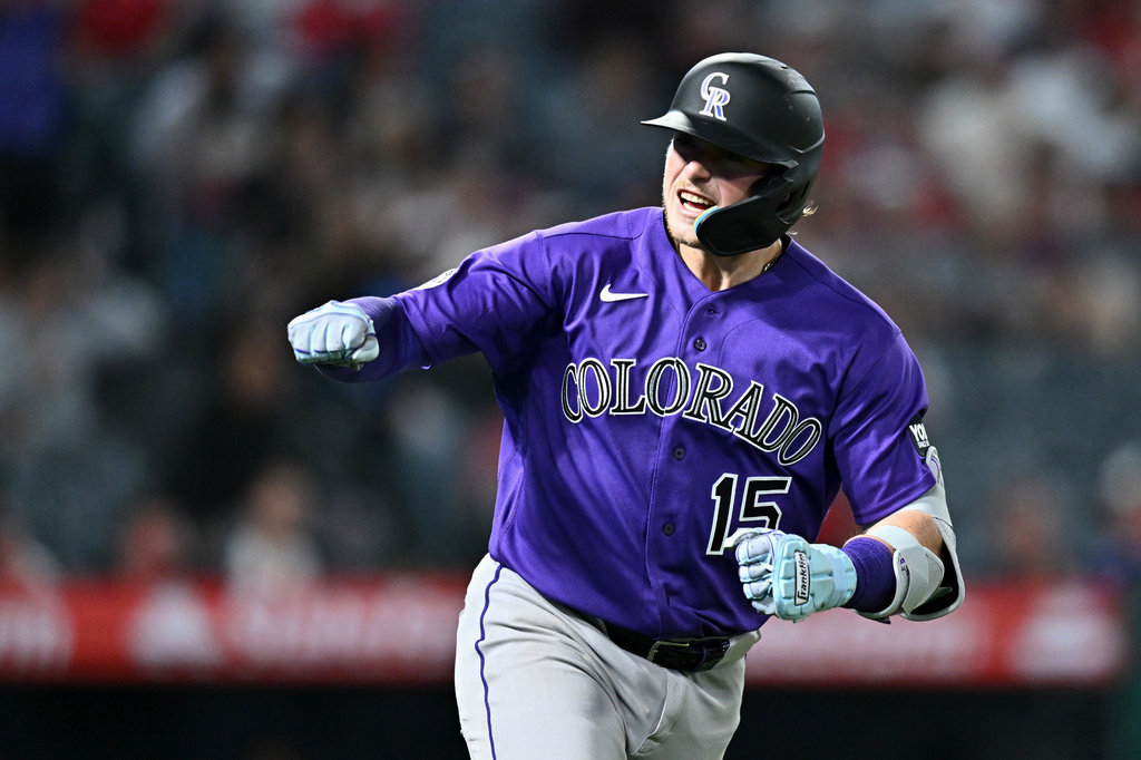 Colorado Rockies' Hunter Goodman reacts after hitting a home run during the eighth inning of a baseball game against the Los Angeles Angels, Monday, June 1, 2026, in Anaheim, Calif. (AP Photo/William Liang)