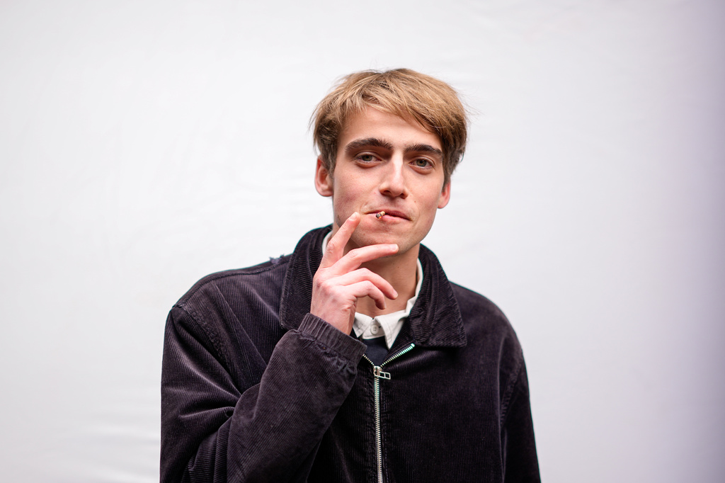 Gusztav Komaromy, 22, poses for a portrait as he smokes a cigarette in Budapest, Hungary, Monday, April 13, 2026. "We had a regime that took control of our lives and political consciousness. We had to take a stance about propaganda, about political cynicism, about the state of the public sphere. " (AP Photo/Petr David Josek)