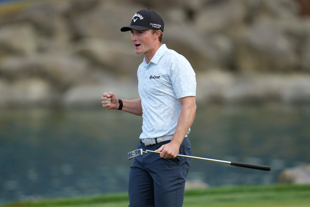 Blades Brown celebrates a birdie putt at the 18th green during the third round of the American Express golf event on the Pete Dye Stadium Course at PGA West Saturday, Jan. 24, 2026, in La Quinta, Calif. (AP Photo/Ross D. Franklin)