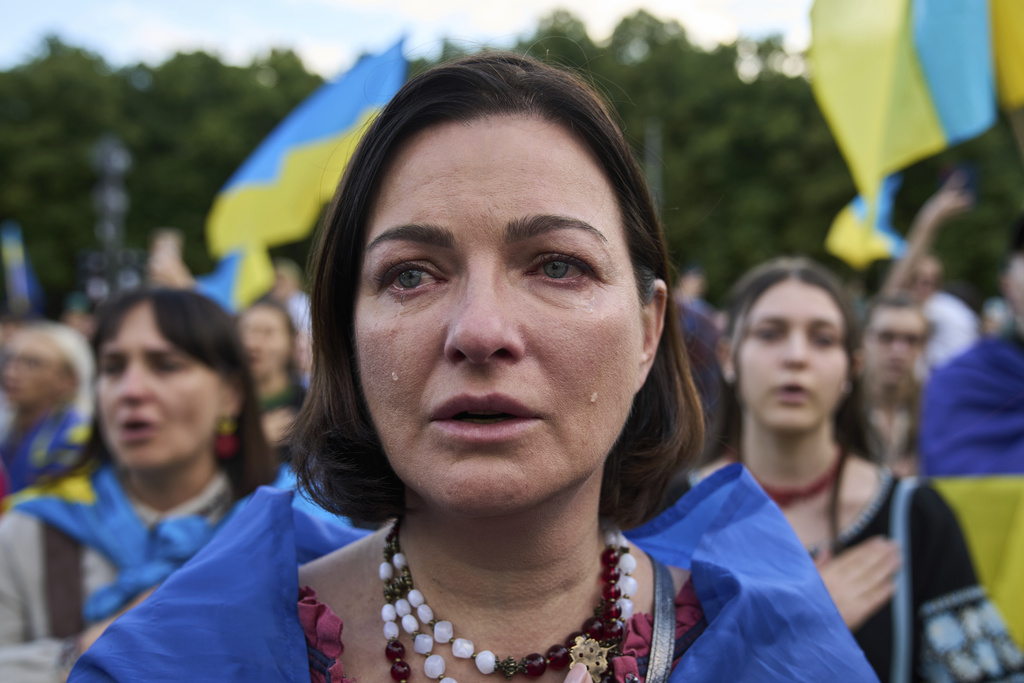 People attend a demonstration to mark Ukraine's Independence Day in Berlin, Germany, Sunday, Aug. 24, 2025. (AP Photo/Ebrahim Noroozi)