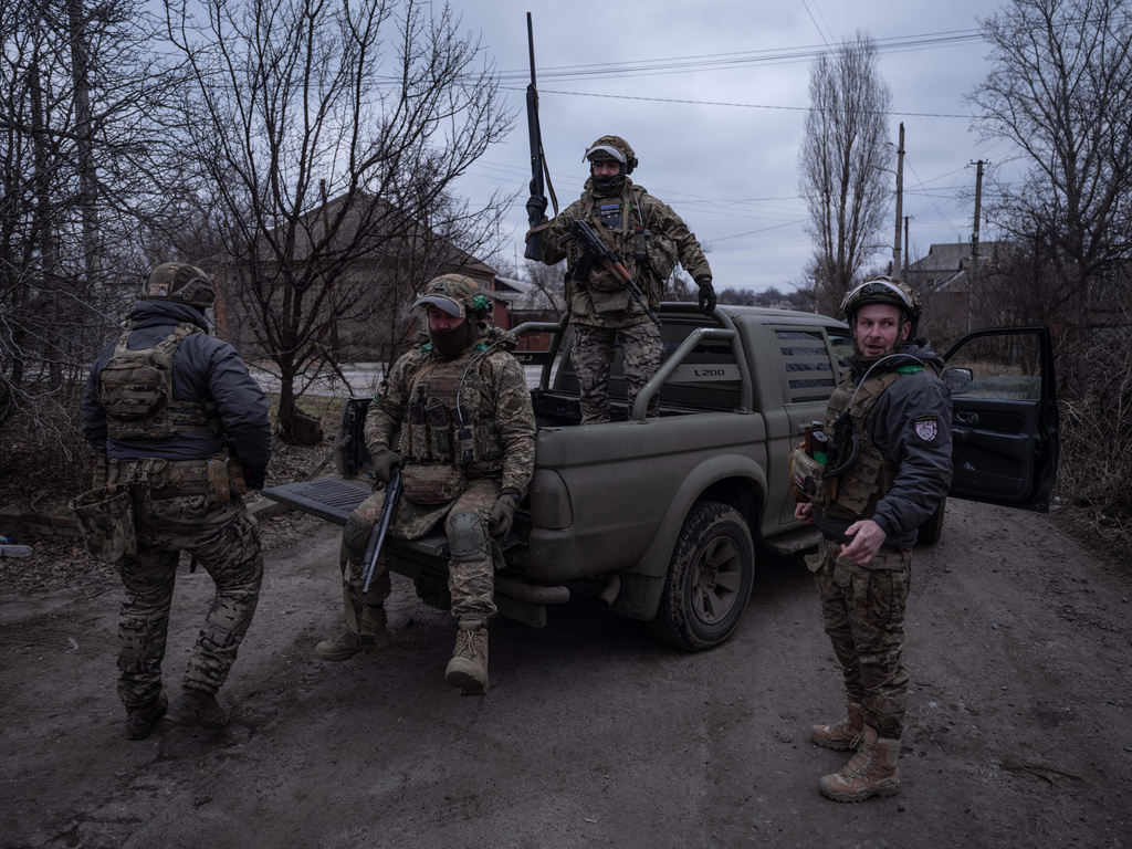 In this photo provided by Ukraine's 93rd Kholodnyi Yar Separate Mechanized Brigade press service, soldiers are at a pickup before assignments on the frontline near Kostyantynivka, Donetsk region, Ukraine, Tuesday, Feb. 17, 2026. (Iryna Rybakova/Ukraine's 93rd Mechanized Brigade via AP)