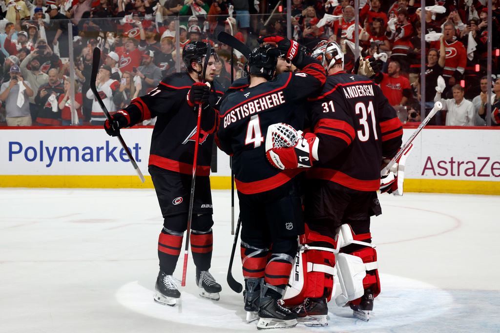 Carolina Hurricanes players join goaltender Frederik Andersen (31) following Game 5 of the Eastern Conference finals NHL hockey Stanley Cup playoff series against the Montreal Canadiens in Raleigh, N.C., Friday, May 29, 2026. (AP Photo/Karl DeBlaker)