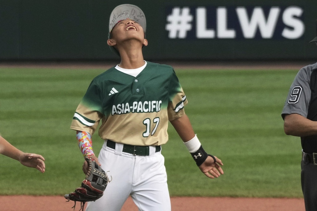 Taiwan's Jian Zih-De celebrates his team's victory over Las Vegas, Nev. at the end of the Little League World Series Championship game, in South Williamsport, Pa., Sunday, Aug. 24, 2025. (AP Photo/Gene J. Puskar)