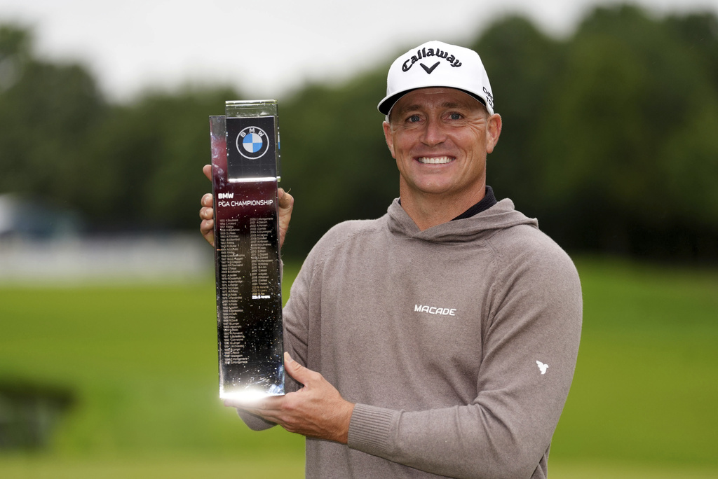 Alex Noren celebrates with the trophy after day four of the 2025 BMW PGA Championship at Wentworth Golf Club in Virginia Water, Surrey, England, Sunday Sept. 14, 2025. (Adam Davy/PA via AP)
