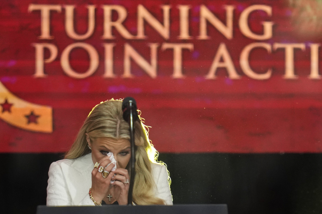 Erika Kirk wipes tears from her eyes before speaking at a memorial for her late husband conservative activist Charlie Kirk, Sunday, Sept. 21, 2025, at State Farm Stadium in Glendale, Ariz. (AP Photo/John Locher)