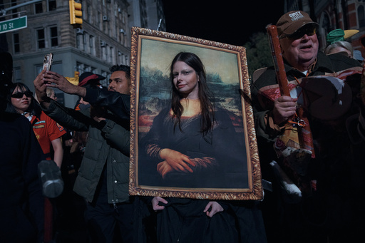 A reveler pauses for a photograph during the Village Halloween Parade on Friday, Oct. 31, 2025, in New York. (AP Photo/Andres Kudacki) A reveler pauses for a photograph during the Village Halloween Parade on Friday, Oct. 31, 2025, in New York. (AP Photo/Andres Kudacki)
