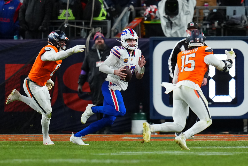 Buffalo Bills quarterback Josh Allen (17) runs the ball during overtime of an NFL divisional round playoff football game against the Denver Broncos, Saturday, Jan. 17, 2026, in Denver. (AP Photo/Jack Dempsey)