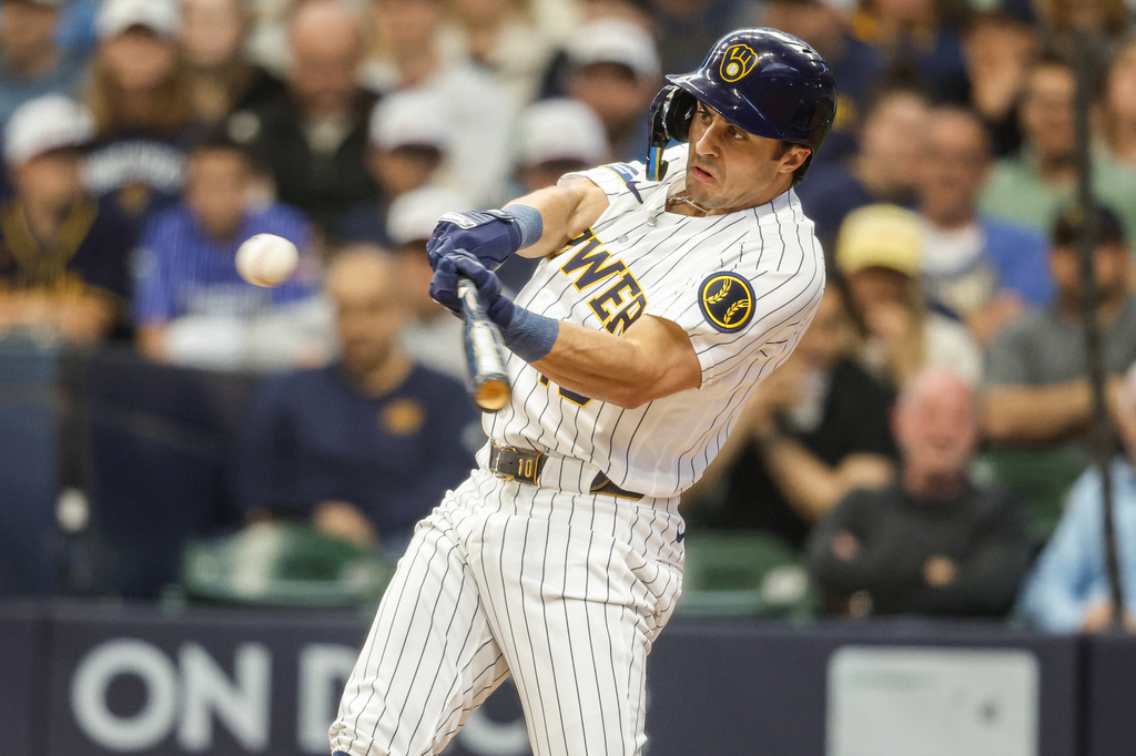 Milwaukee Brewers' Sal Frelick hits a run-scoring single during the first inning of a baseball game against the Los Angeles Dodgers, Saturday, May 23, 2026, in Milwaukee. (AP Photo/Jeffrey Phelps)
