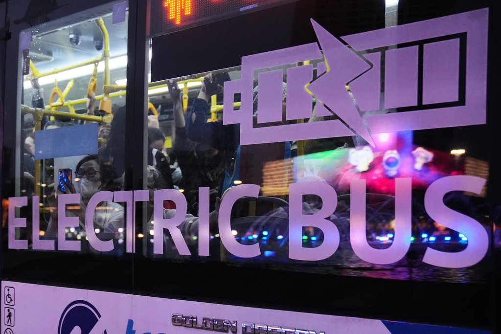 Passengers ride on an electric bus in Jakarta, Indonesia, on Feb. 13, 2026. (AP Photo/Dita Alangkara)