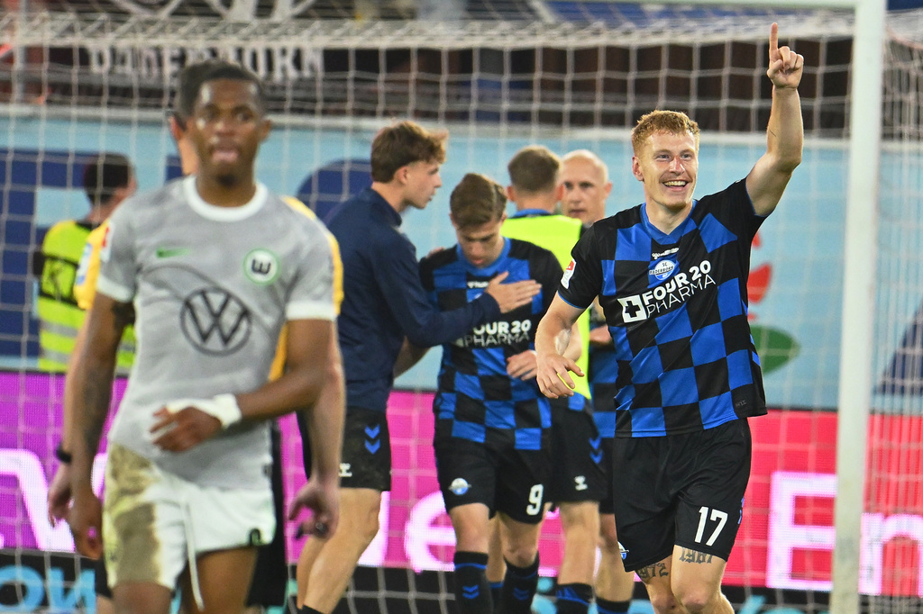 Paderborn's Laurin Curda celebrates after scoring his side's second goal during the soccer relegation match between German second division team SC Paderborn and German first division team VfL Wolfsburg in Paderborn, Germany, Monday, May 25, 2026. (Swen Pfoertner/dpa via AP)