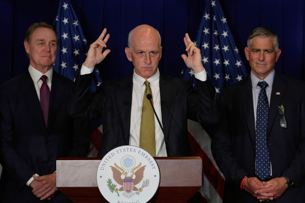 U.S. Rep. Adam Smith, D-Wash, center, speaks during a press conference at the U.S. Embassy in Beijing, China, Tuesday, Sept. 23, 2025. (AP Photo/Mahesh Kumar A.)