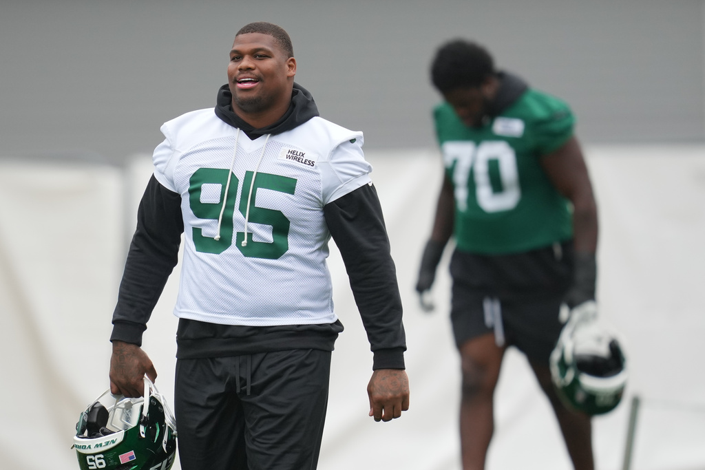 New York Jets defensive tackle Quinnen Williams (95), attends an NFL football practice at The Grove in Watford, England, Friday, Oct. 10, 2025. (AP Photo/Kin Cheung)