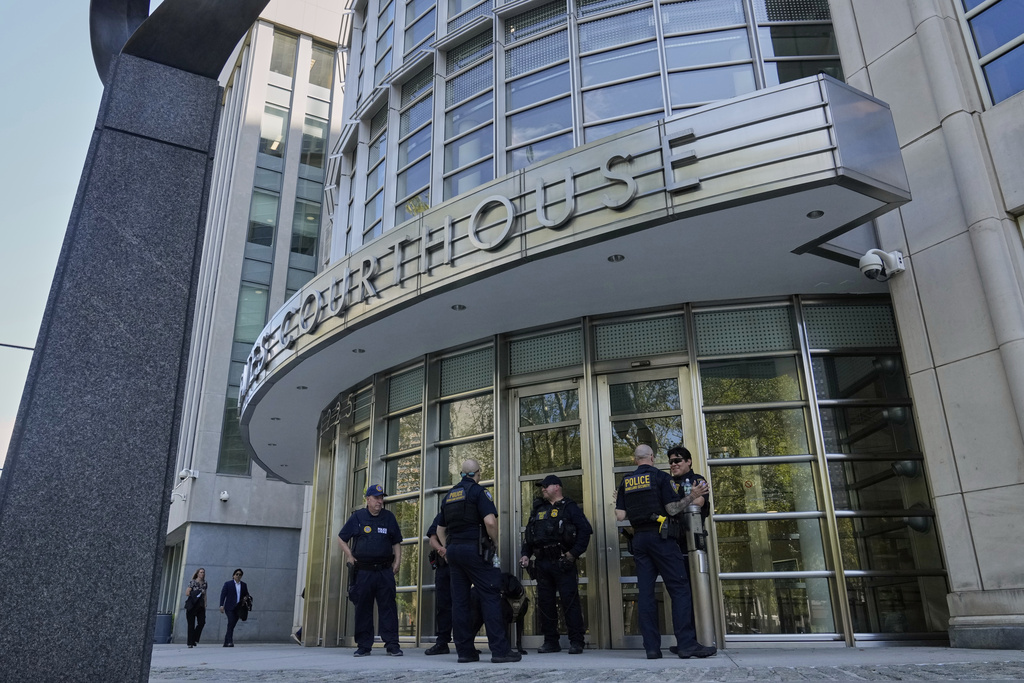 A group of Department of Homeland Security Police stand outside Federal court in the Brooklyn borough of New York, Monday, Aug. 25, 2025. (AP Photo/Richard Drew)
