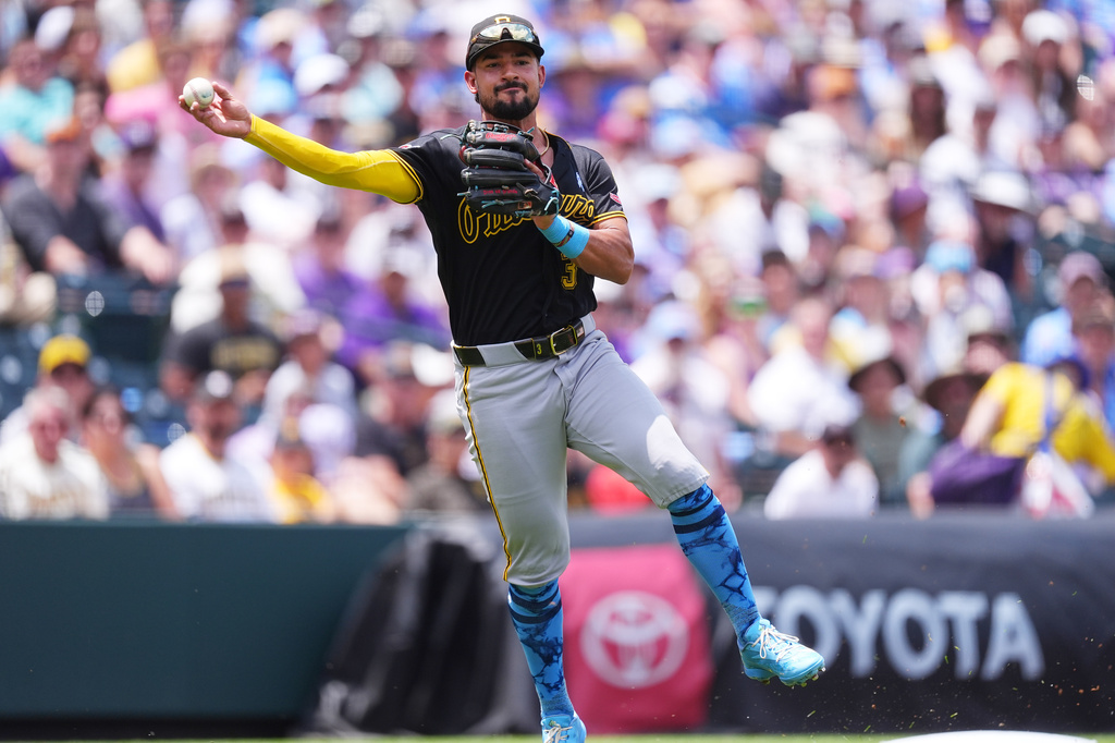 Pittsburgh Pirates third baseman Nick Gonzales throws to first base after fielding an infield single off the bat of Colorado Rockies' Tyler Freeman in the second inning of a baseball game Sunday, June 21, 2026, in Denver. (AP Photo/David Zalubowski)