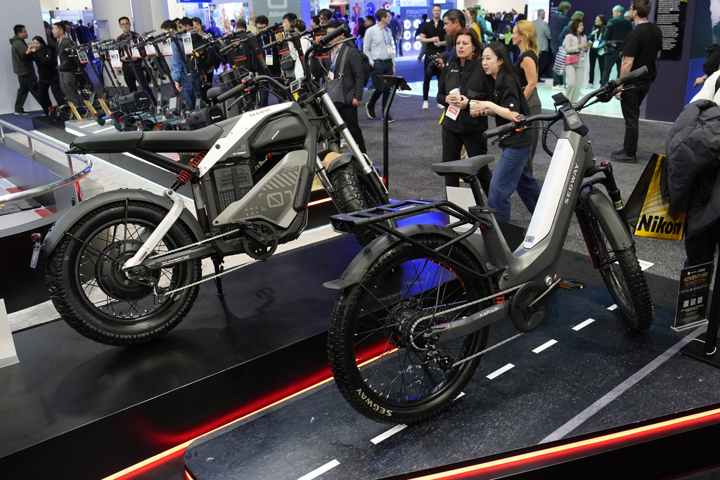 The Segway Xafari, right and Xyber e-bikes sit on display during the CES tech show Tuesday, Jan. 7, 2025, in Las Vegas. (AP Photo/John Locher)