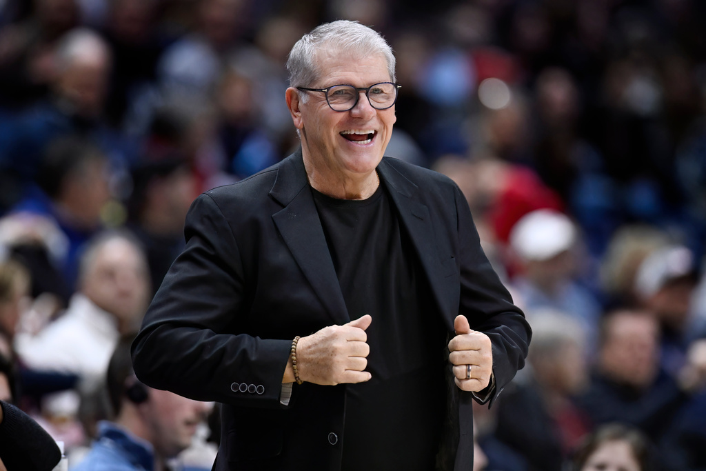 UConn head coach Geno Auriemma smiles in the first half of an NCAA college basketball game against Creighton, Wednesday, Feb. 11, 2026, in Storrs, Conn. (AP Photo/Jessica Hill)
