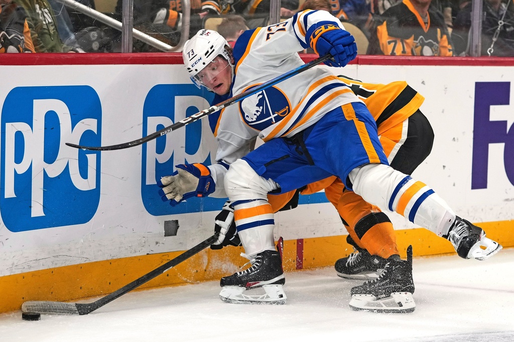 Buffalo Sabres Zach Metsa (73) collides with Pittsburgh Penguins Blake Lizotte during the second period of an NHL hockey game in Pittsburgh, Thursday, March 5, 2026. (AP Photo/Gene J. Puskar)