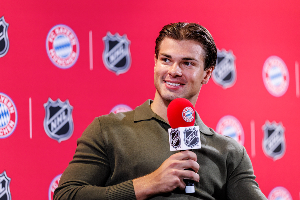 Boston Bruins’ John-Jason Peterka, speaks during a joint press conference by FC Bayern Munich and the National Hockey League, Thursday, Aug. 20, 2026, in Munich. (Matthias Balk/dpa via AP)