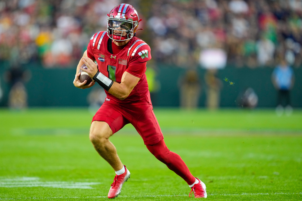 Wisconsin quarterback Colton Joseph runs the ball during the first half of an NCAA college football game against Notre Dame Sunday, Sept. 6, 2026, in Green Bay, Wis. (AP Photo/Kayla Wolf)