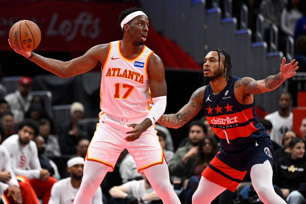 Atlanta Hawks forward Onyeka Okongwu (17) is guarded by Washington Wizards forward Cam Whitmore during the first half of a Emirates NBA Cup basketball game Tuesday, Nov. 25, 2025, in Washington. (AP Photo/John McDonnell)