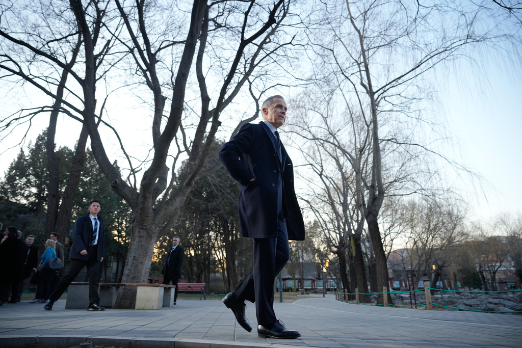 Canada's Prime Minister Mark Carney, leaves after speaking to the media at Ritan Park in Beijing, China, Friday, Jan. 16, 2026. (AP Photo/Vincent Thian)