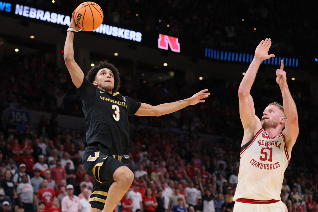 Vanderbilt guard Tyler Tanner (3) goes to the basket against Nebraska forward Rienk Mast (51) during the first half in the second round of the NCAA college basketball tournament, Saturday, March 21, 2026, in Oklahoma City. (AP Photo/Nate Billings)